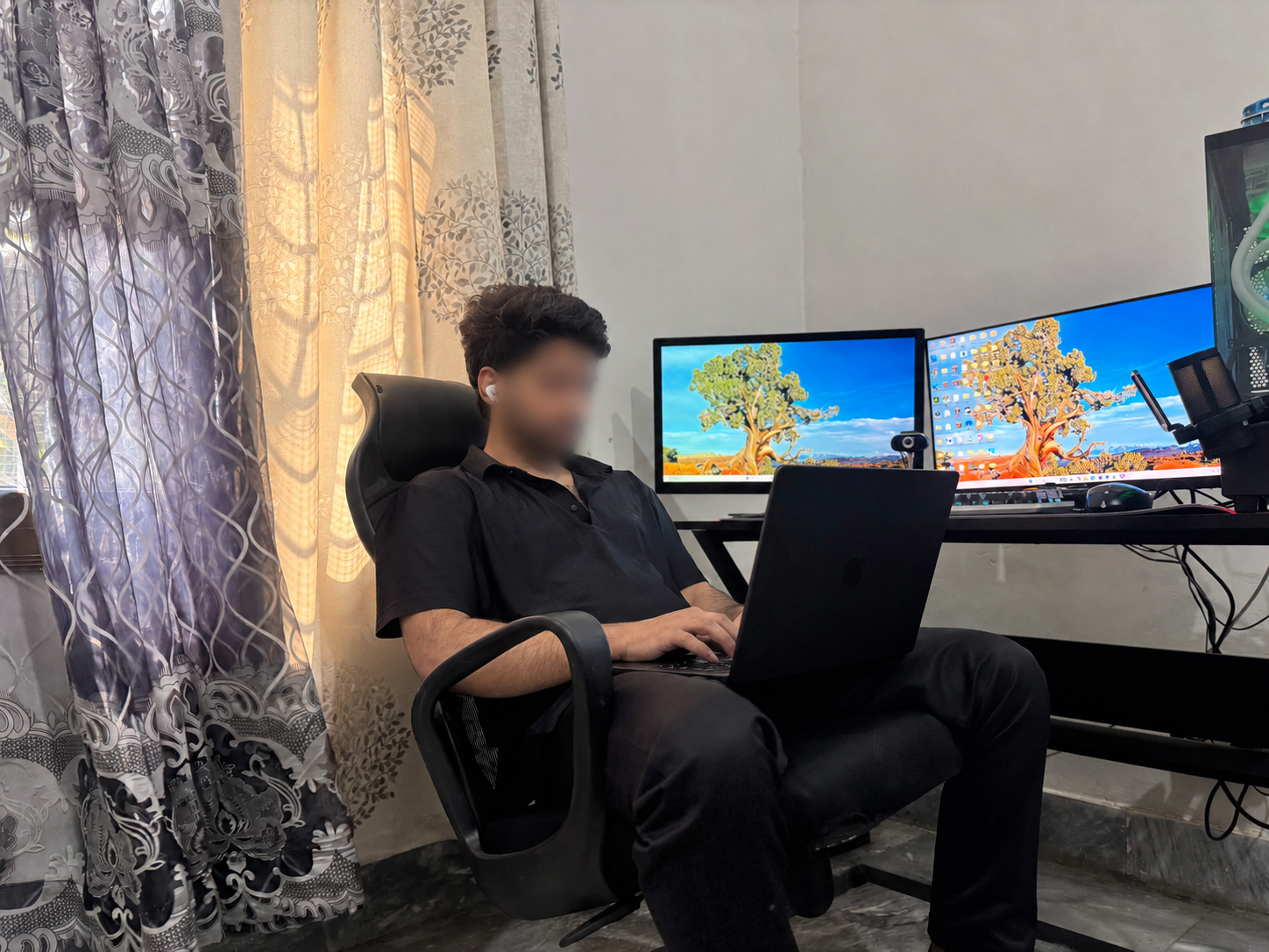 Burhan Ahmad working at his desk